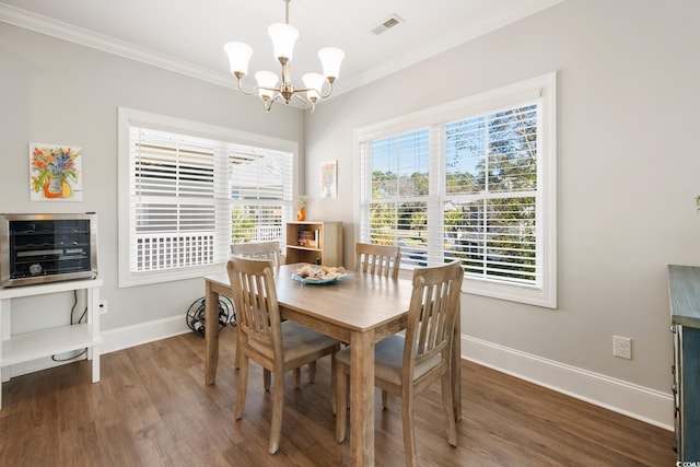 dining area with wood-type flooring, ornamental molding, beverage cooler, and a chandelier