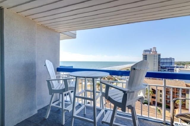 balcony featuring a water view