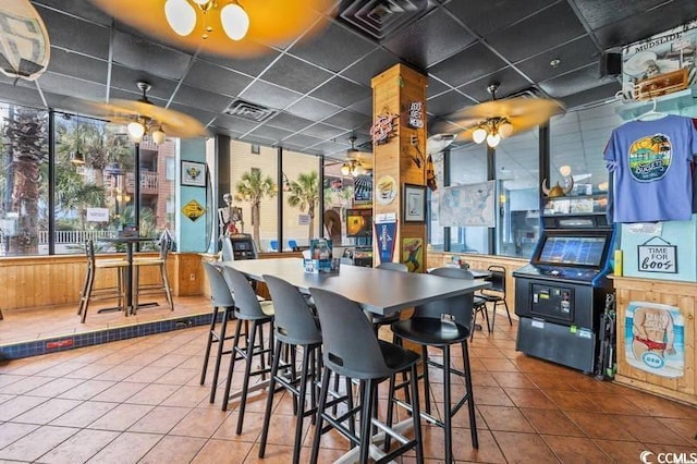 kitchen featuring visible vents, a paneled ceiling, and tile patterned flooring