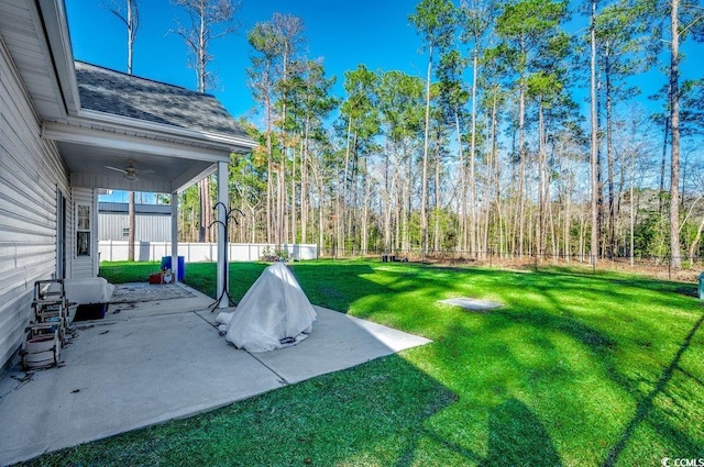 view of yard with ceiling fan