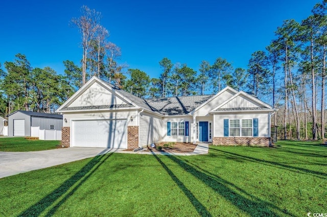 view of front of property with a garage and a front lawn