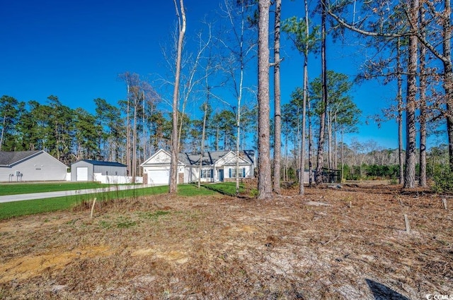 view of yard with a garage