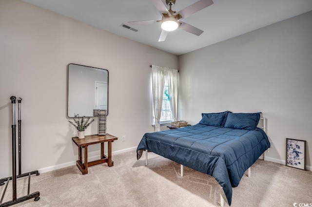 carpeted bedroom with ceiling fan