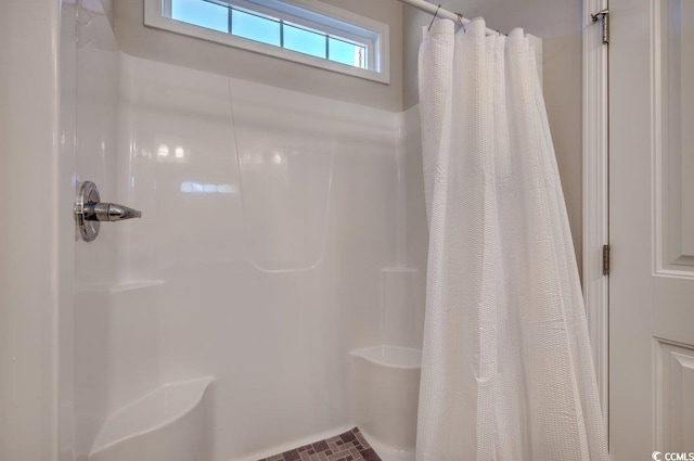 bathroom featuring walk in shower