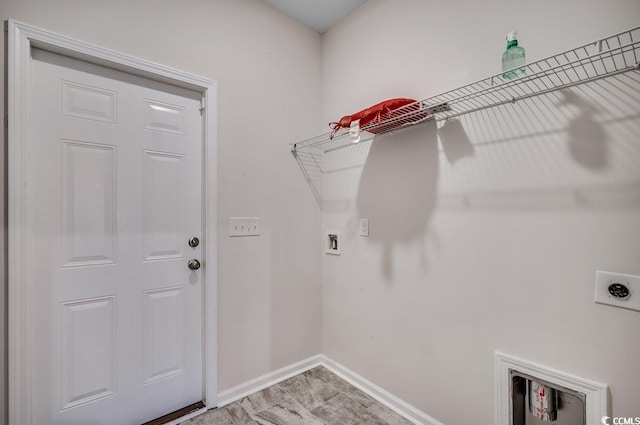 laundry room with hookup for a washing machine and hookup for an electric dryer