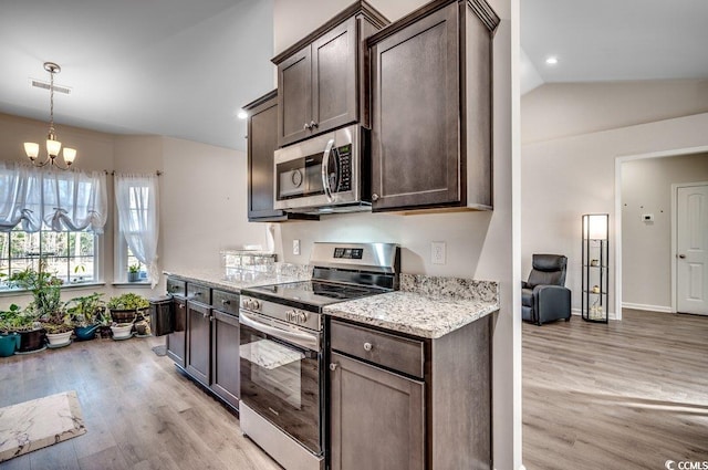 kitchen with dark brown cabinets, light stone countertops, light hardwood / wood-style floors, and appliances with stainless steel finishes