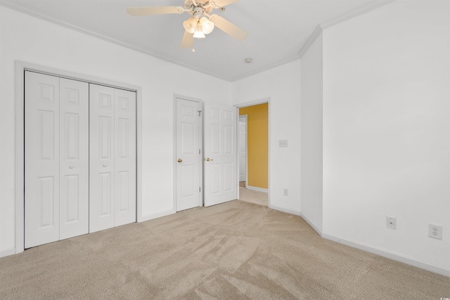 1529 Lanterns Rest Dr Unit 201, Myrtle Beach, SC 29579 - unfurnished bedroom with carpet floors, ornamental molding, baseboards, ceiling fan, and a closet