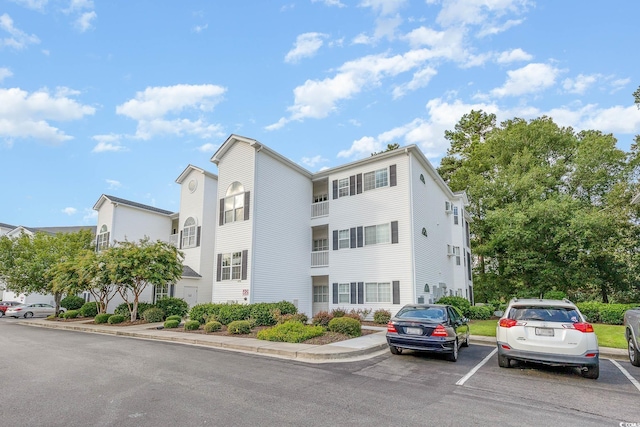 1529 Lanterns Rest Dr Unit 201, Myrtle Beach, SC 29579 - view of building exterior with uncovered parking