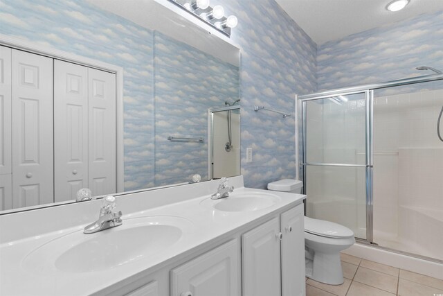 1529 Lanterns Rest Dr Unit 201, Myrtle Beach, SC 29579 - full bath featuring wallpapered walls, tile patterned floors, toilet, a stall shower, and double vanity