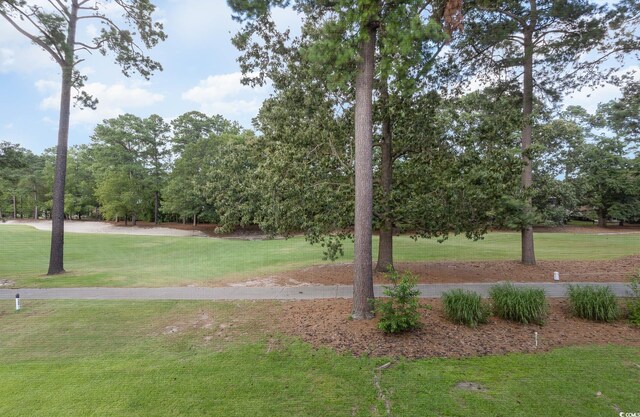 1529 Lanterns Rest Dr Unit 201, Myrtle Beach, SC 29579 - view of grassy yard featuring view of wooded area