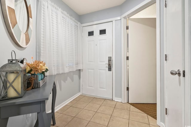 foyer with light tile patterned floors