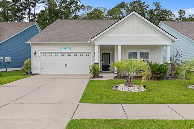 view of front facade featuring a garage, driveway, a shingled roof, board and batten siding, and a front yard