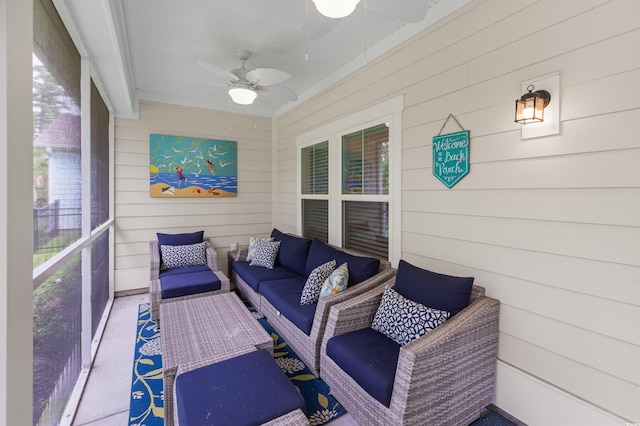 sunroom / solarium with a ceiling fan