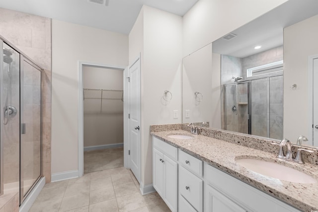 full bath featuring a stall shower, visible vents, and a sink