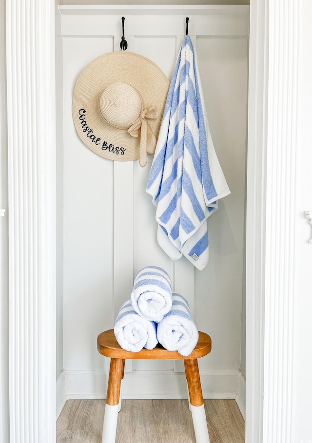 mudroom featuring baseboards and wood finished floors