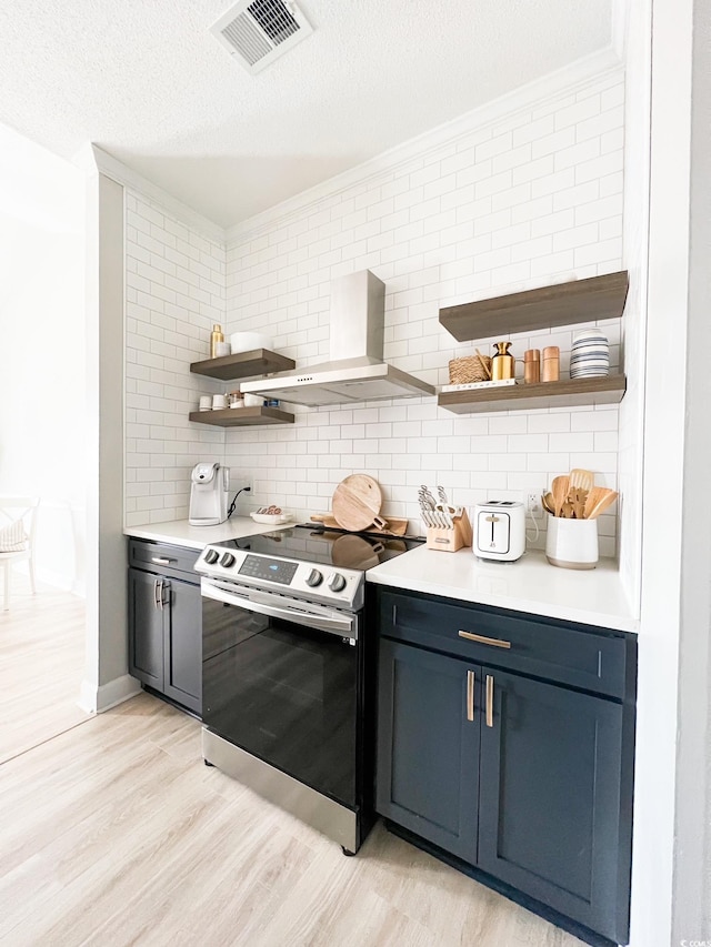 kitchen featuring wall chimney range hood, light wood-type flooring, ornamental molding, stainless steel electric range, and open shelves