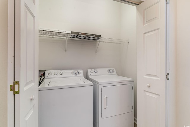 washroom with washer and clothes dryer