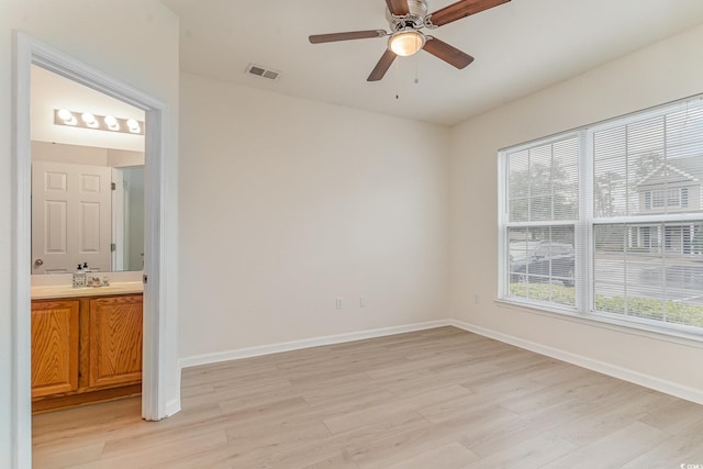 unfurnished room with light hardwood / wood-style floors and ceiling fan