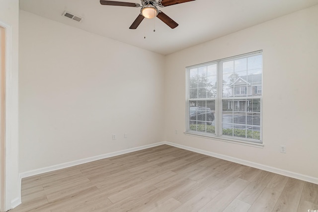 spare room with ceiling fan and light hardwood / wood-style flooring