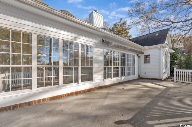 1639 Coventry Rd, Surfside Beach, SC 29575 - rear view of property featuring a patio area, a chimney, and a shingled roof