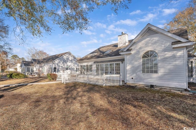 back of property with a yard
