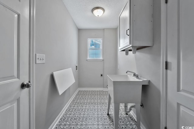 bathroom featuring a textured ceiling