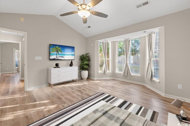 1639 Coventry Rd, Surfside Beach, SC 29575 - unfurnished living room with healthy amount of natural light, light wood-style flooring, lofted ceiling, and baseboards