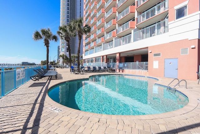 view of pool featuring a patio area