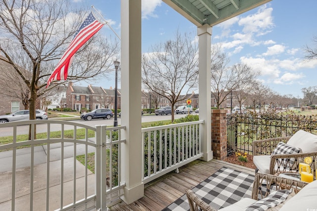 balcony with covered porch and a residential view