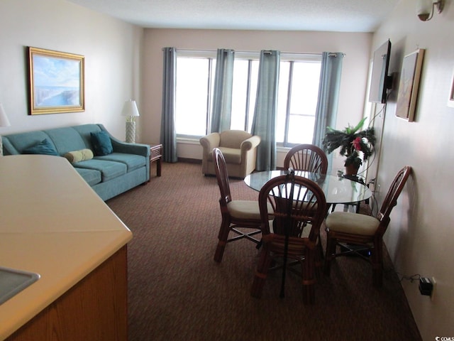 view of carpeted dining area