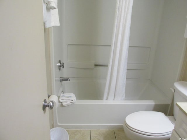 bathroom featuring tile patterned flooring, vanity, toilet, and shower / tub combo