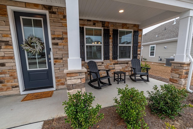 view of patio / terrace featuring central air condition unit and a porch