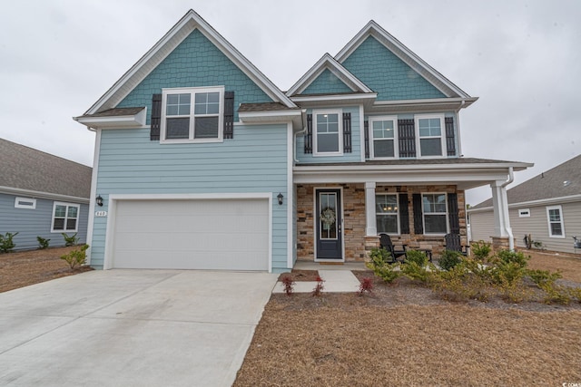 craftsman-style home featuring a garage and covered porch