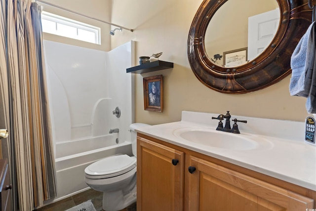 full bathroom featuring toilet, vanity, and tub / shower combination