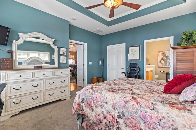 bedroom featuring carpet flooring, connected bathroom, ceiling fan, crown molding, and a raised ceiling