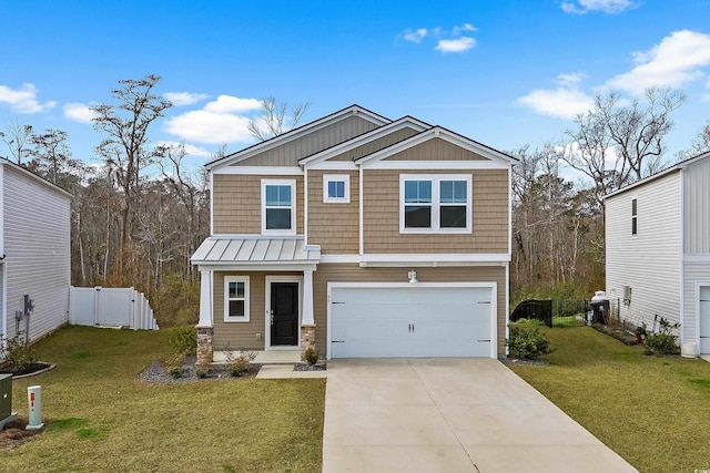 craftsman-style home featuring a front yard and a garage