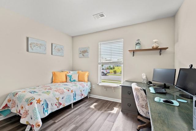 bedroom featuring dark hardwood / wood-style floors