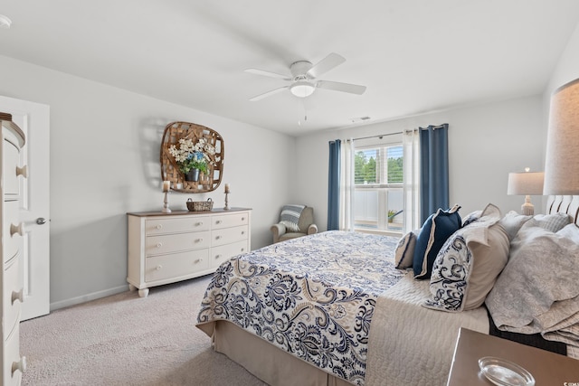 bedroom with light carpet and ceiling fan