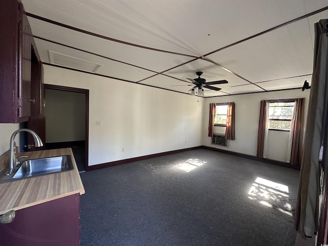 interior space with ceiling fan and sink