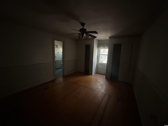 empty room with hardwood / wood-style flooring and ceiling fan