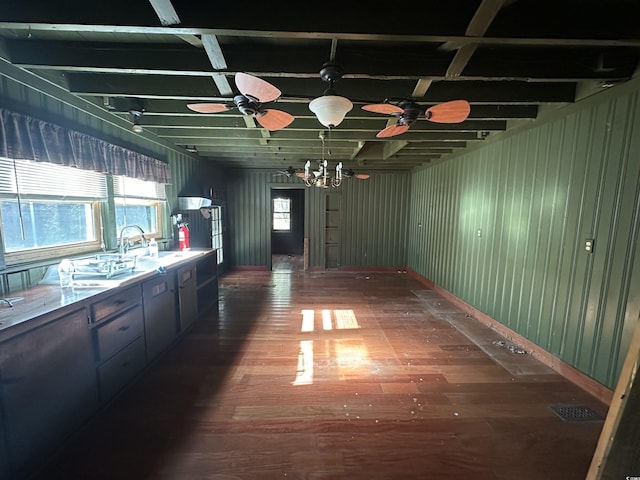 interior space featuring beam ceiling, dark wood-type flooring, and ceiling fan