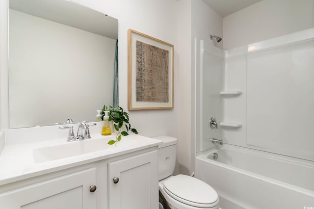 bathroom featuring toilet, vanity, and tub / shower combination