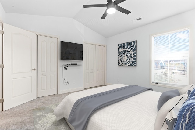 763 Moen Pl Unit 763-A, Myrtle Beach, SC 29577 - bedroom featuring multiple closets, carpet flooring, vaulted ceiling, and a ceiling fan