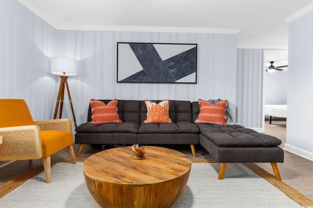 living room featuring crown molding and wood-type flooring