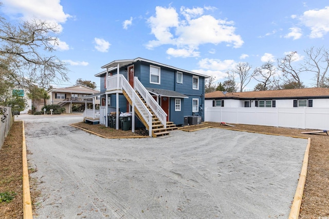 back of property with central AC