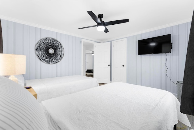 bedroom featuring crown molding and ceiling fan