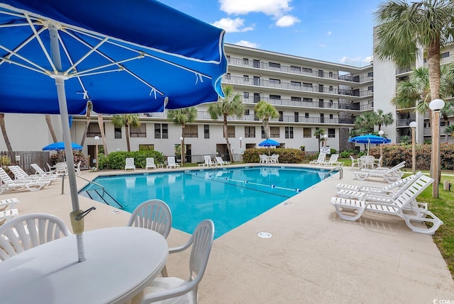 view of swimming pool featuring a patio area