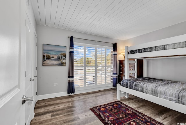 bedroom featuring wood ceiling and wood-type flooring