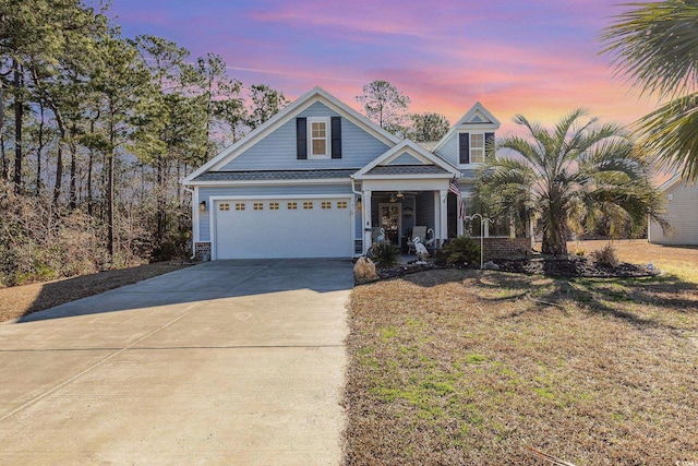 view of front facade featuring a garage and a porch