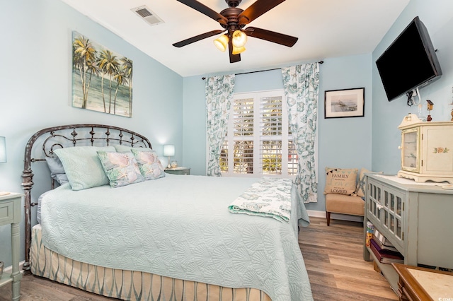 bedroom with ceiling fan and light hardwood / wood-style floors